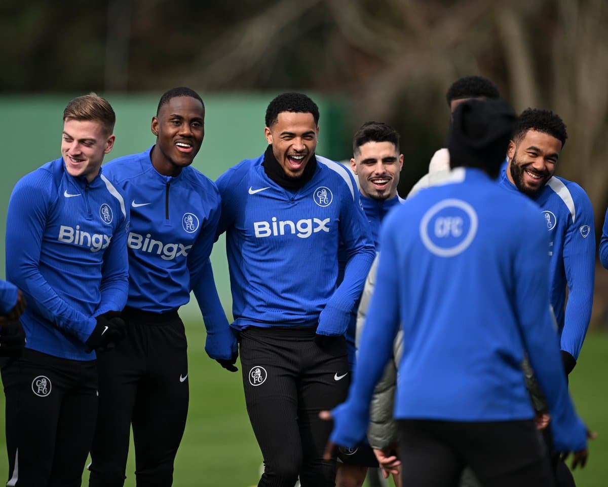 Players laughing during training session in blue kits Players laughing during training session in blue kits