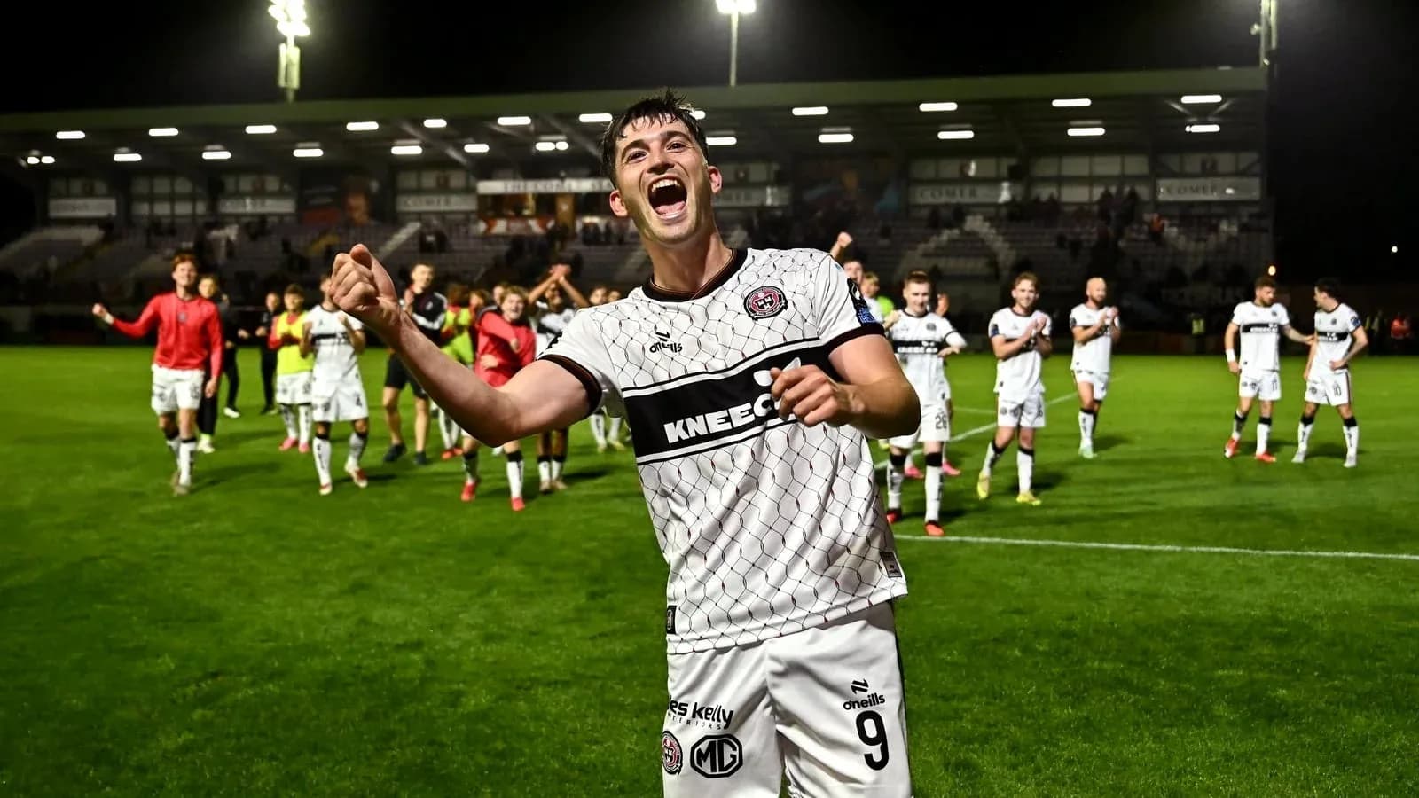 Player celebrating with teammates after match victory Player celebrating with teammates after match victory