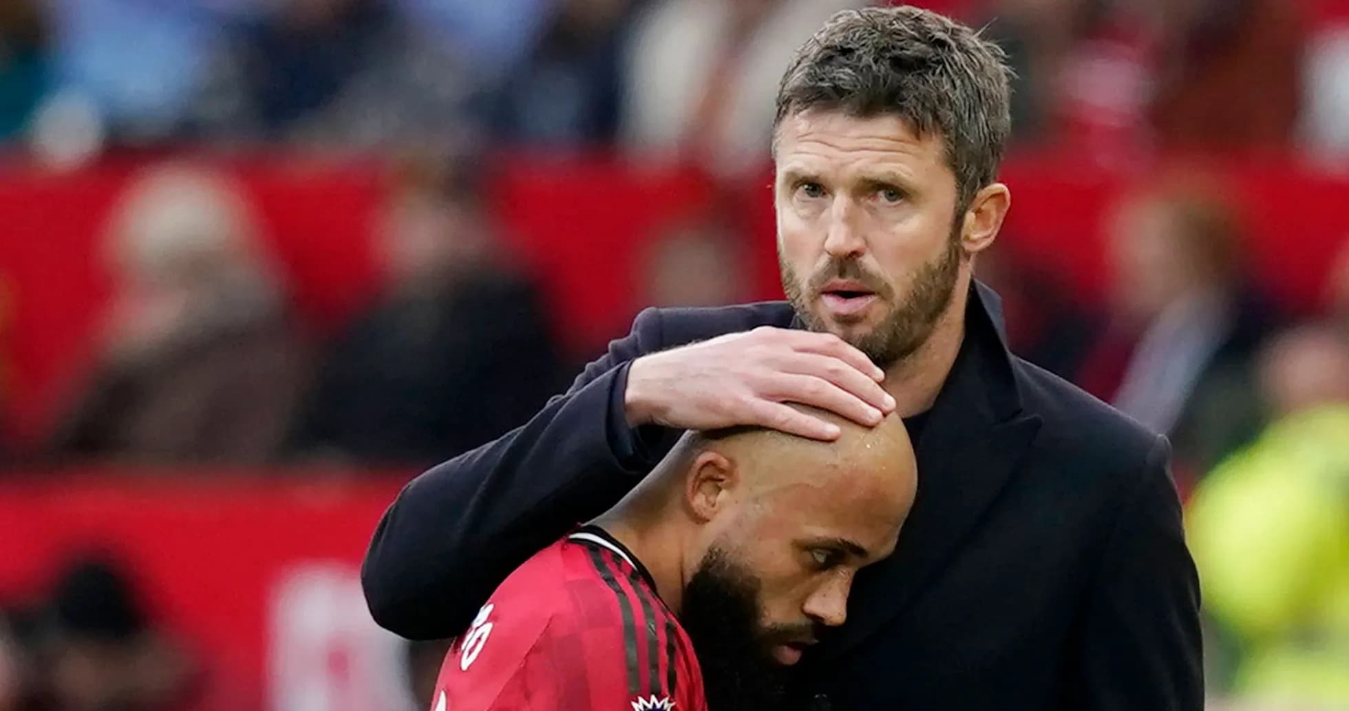 Coach comforting player on the sidelines Coach comforting player on the sidelines
