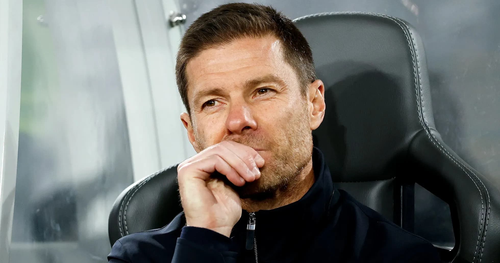Coach sitting on bench during match Coach sitting on bench during match