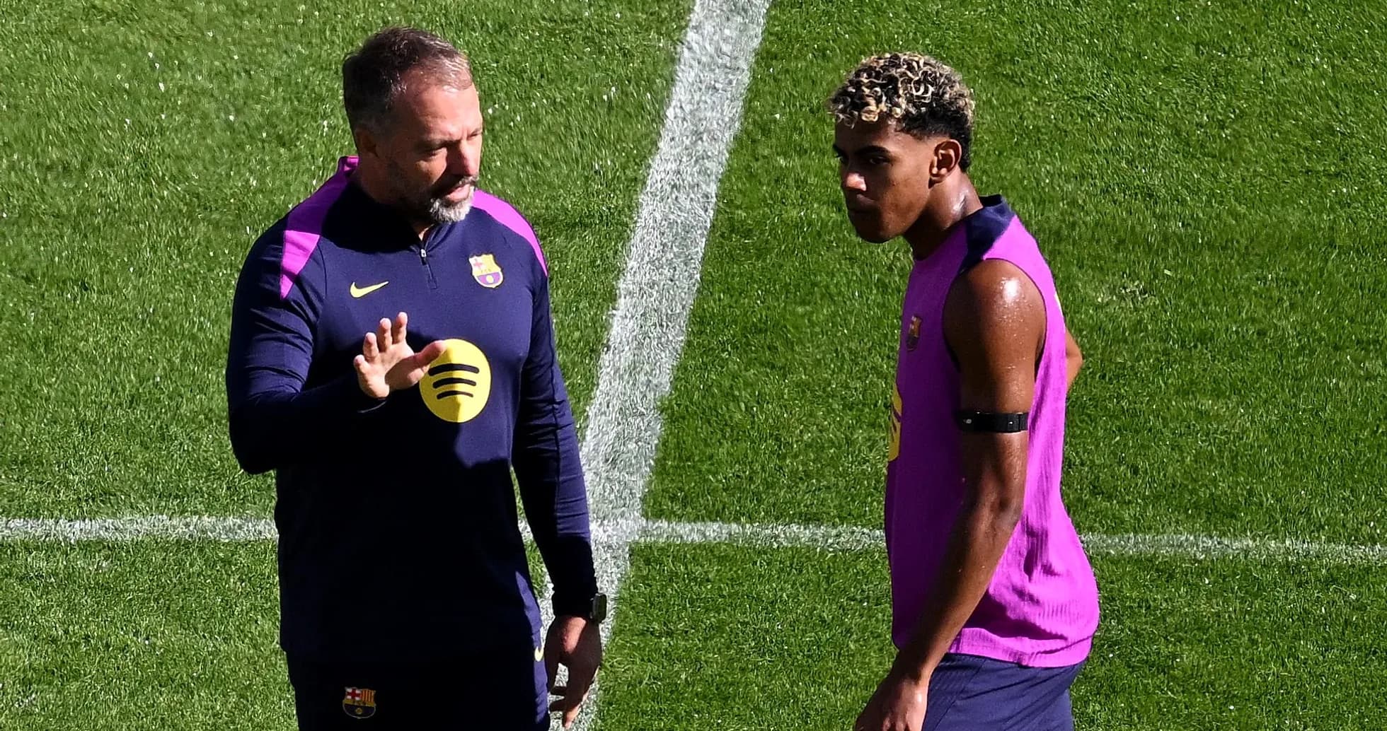 Coach talking to player during training session Coach talking to player during training session