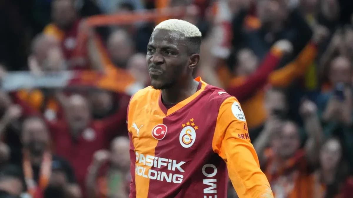 Galatasaray player celebrating a goal with fans Galatasaray player celebrating a goal with fans