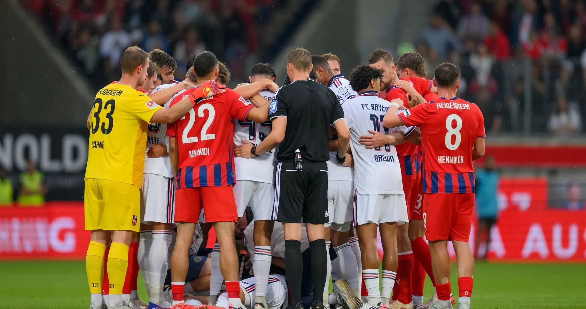 Players from both teams huddled during match Players from both teams huddled during match