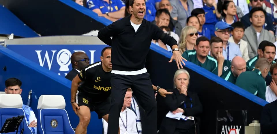 Coach gesturing from the sidelines during a match Coach gesturing from the sidelines during a match