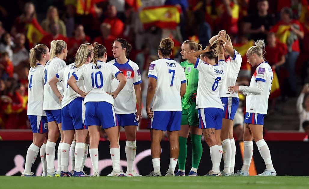 England women's team huddled during a match England women's team huddled during a match