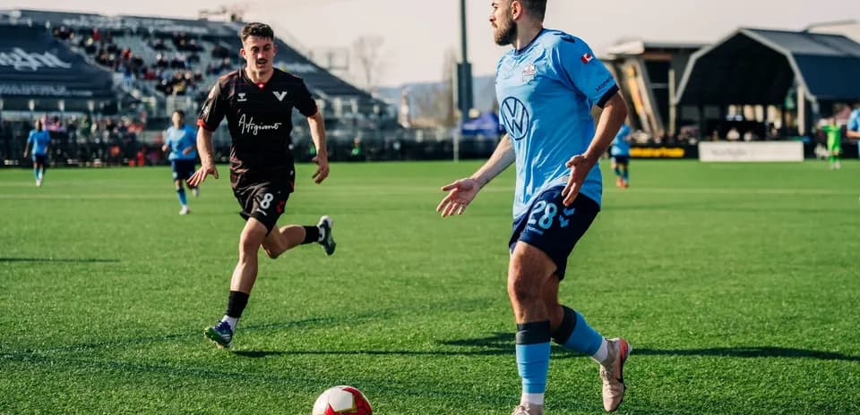 Player dribbling ball during HFX Wanderers match Player dribbling ball during HFX Wanderers match