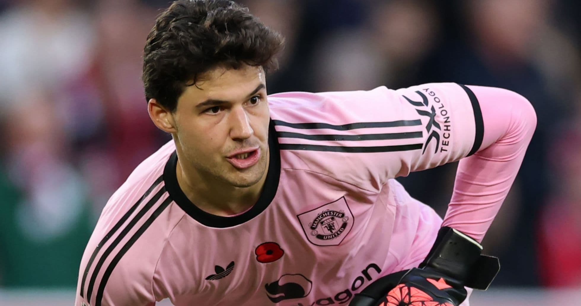 Goalkeeper in pink kit preparing to play Goalkeeper in pink kit preparing to play