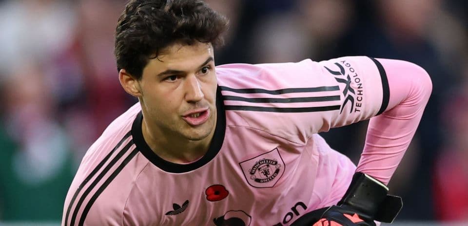 Goalkeeper in pink kit preparing to play Goalkeeper in pink kit preparing to play