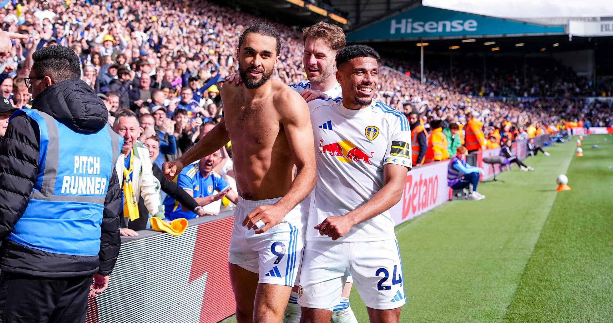 Leeds players celebrating a goal with fans Leeds players celebrating a goal with fans