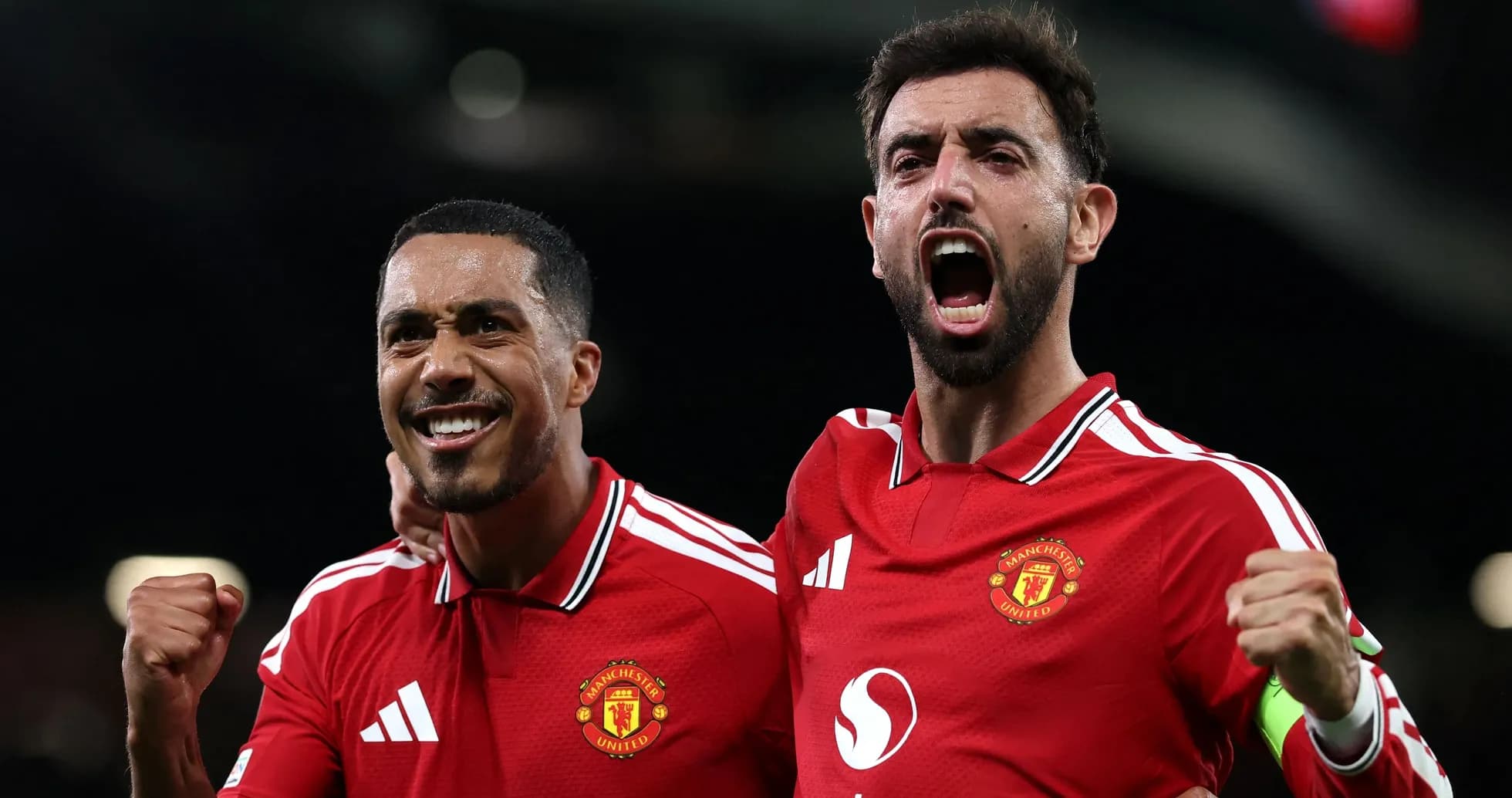 Two Manchester United players celebrating a goal Two Manchester United players celebrating a goal