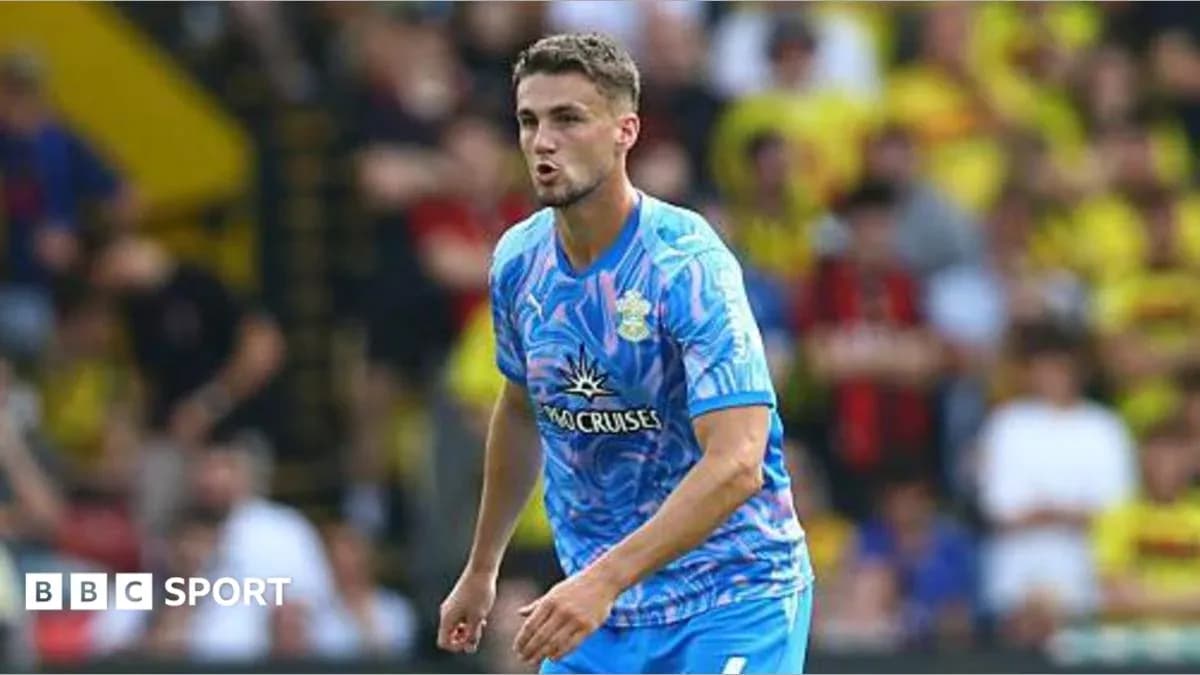 Player in blue kit during match action Player in blue kit during match action