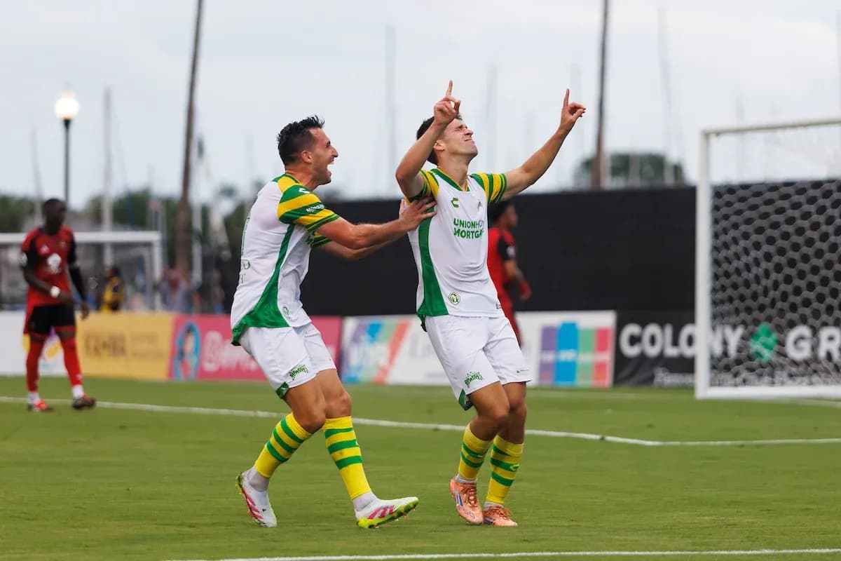 Players celebrating a goal in USL Championship match Players celebrating a goal in USL Championship match
