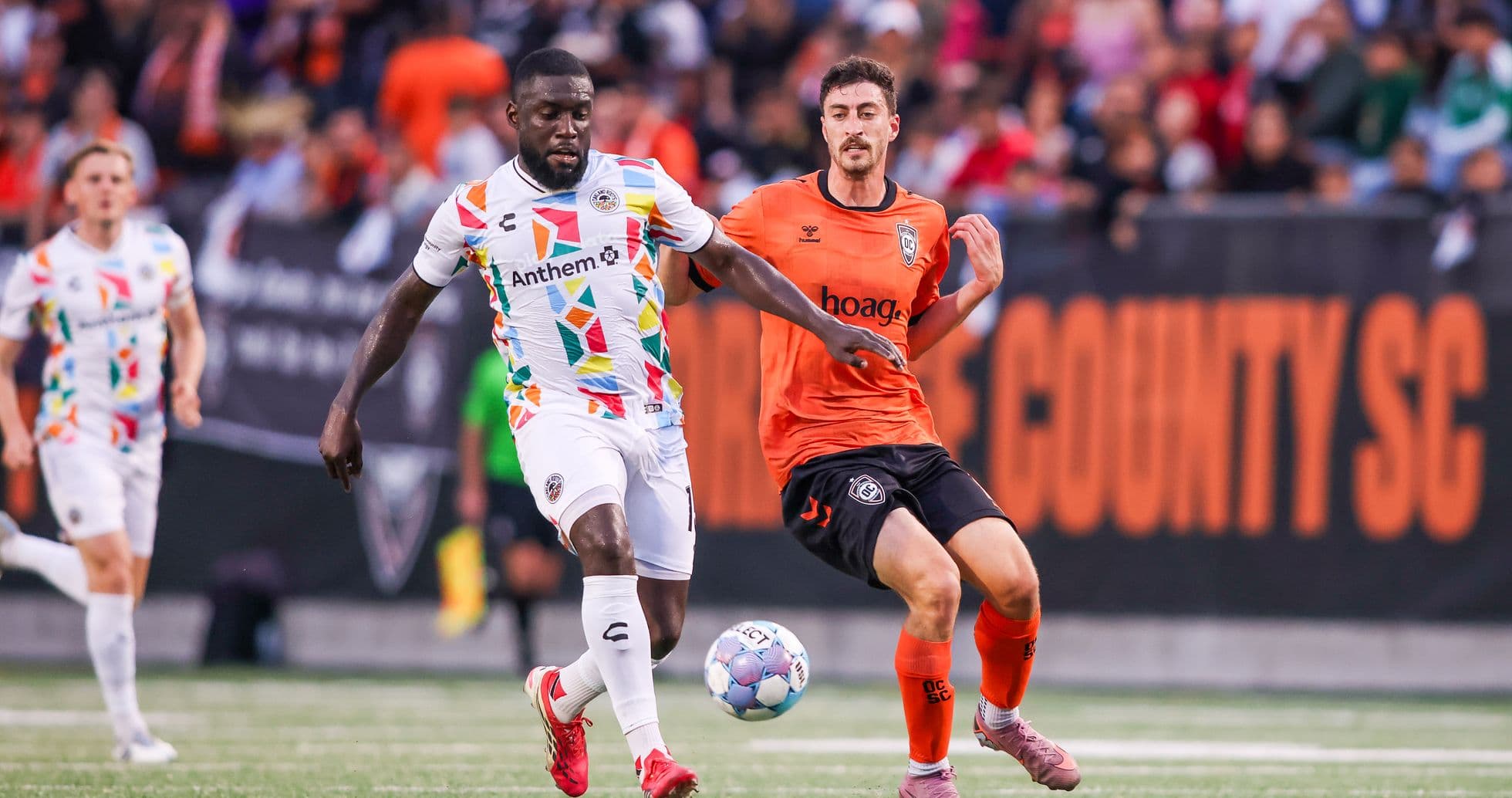 Players competing for the ball during USL match Players competing for the ball during USL match