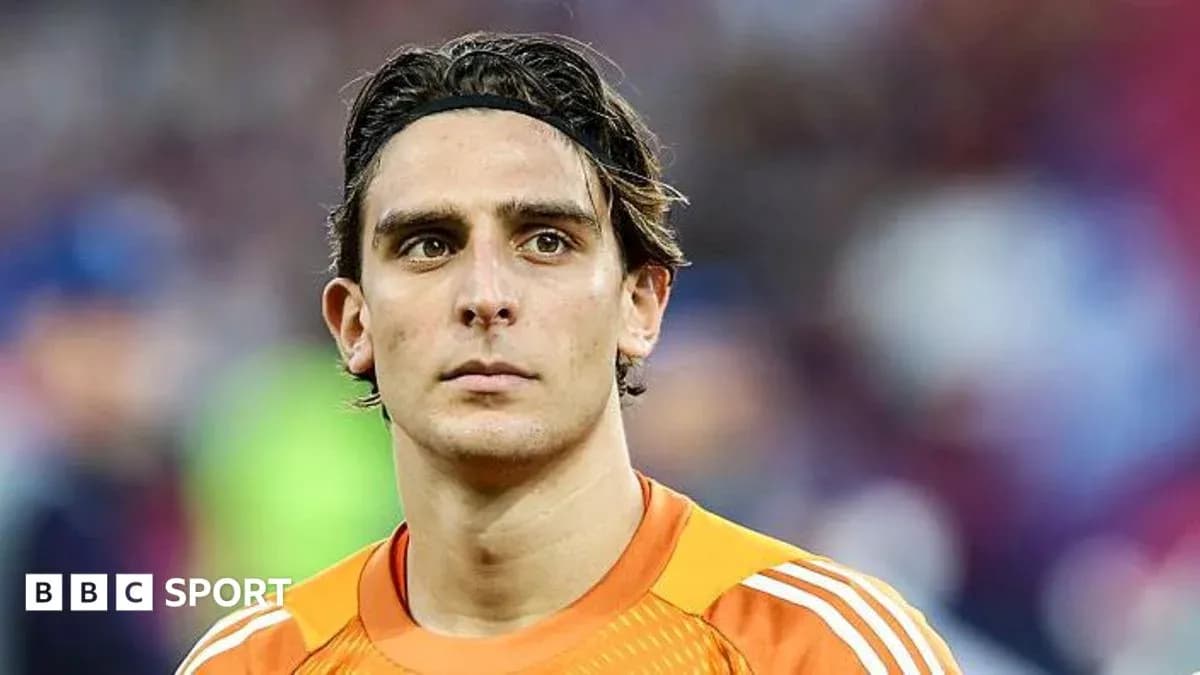 Goalkeeper in orange kit during match Goalkeeper in orange kit during match
