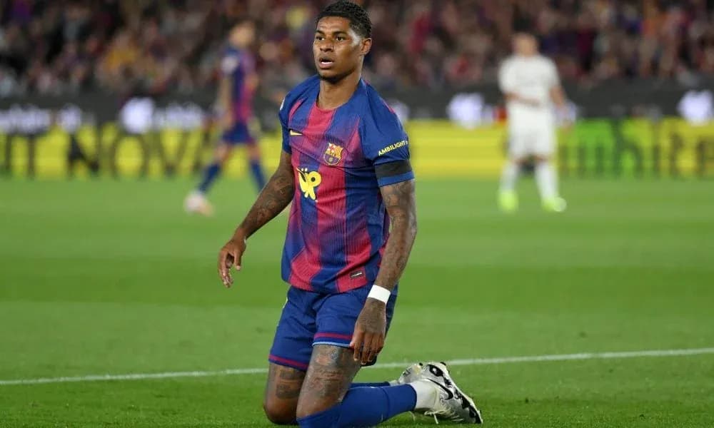 Barcelona player kneeling on pitch during match Barcelona player kneeling on pitch during match
