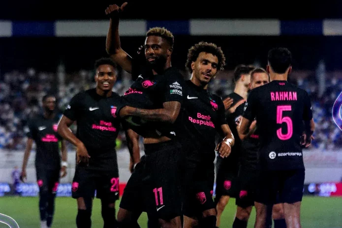 Players celebrating a goal during football match Players celebrating a goal during football match