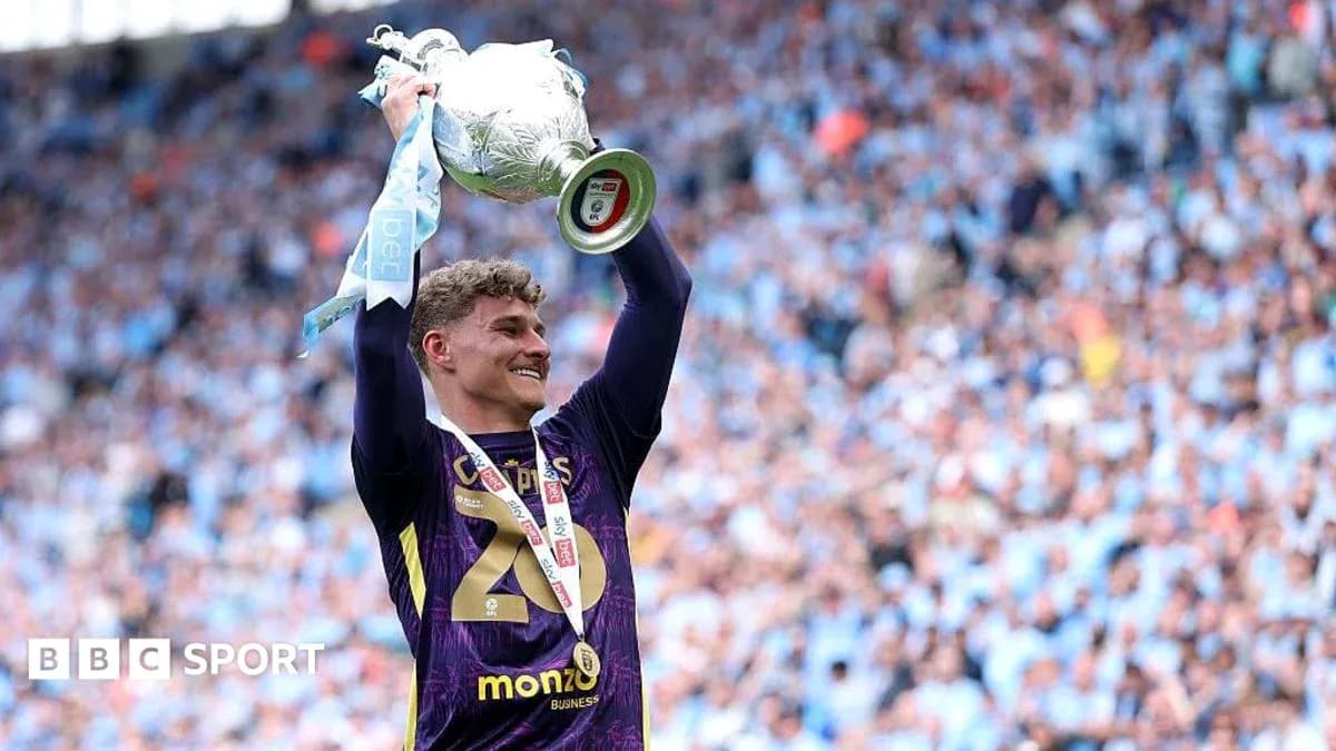 Player celebrating with trophy after winning match Player celebrating with trophy after winning match
