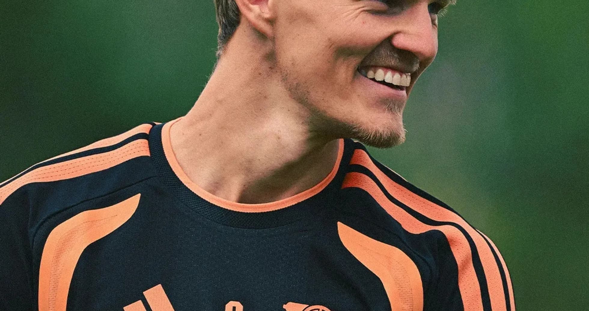 Player smiling in training kit during session Player smiling in training kit during session