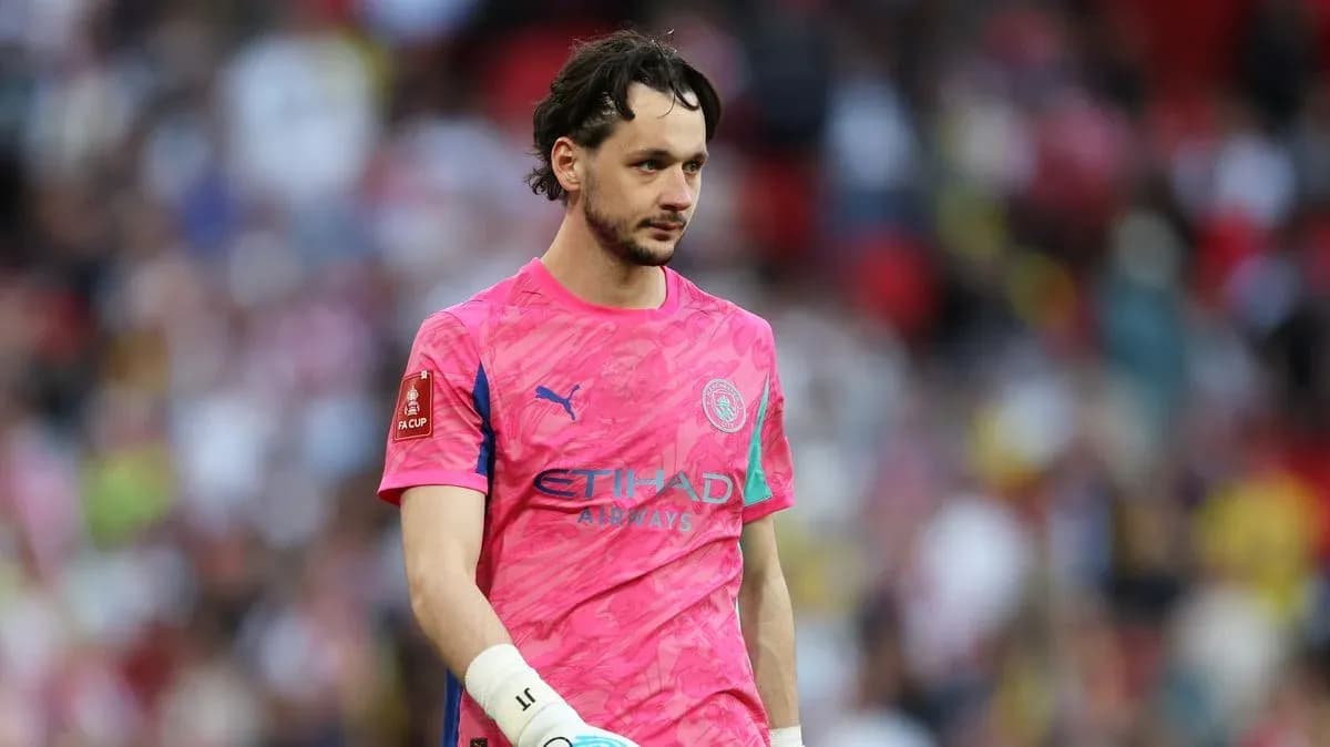 Goalkeeper wearing pink kit walking off the pitch Goalkeeper wearing pink kit walking off the pitch
