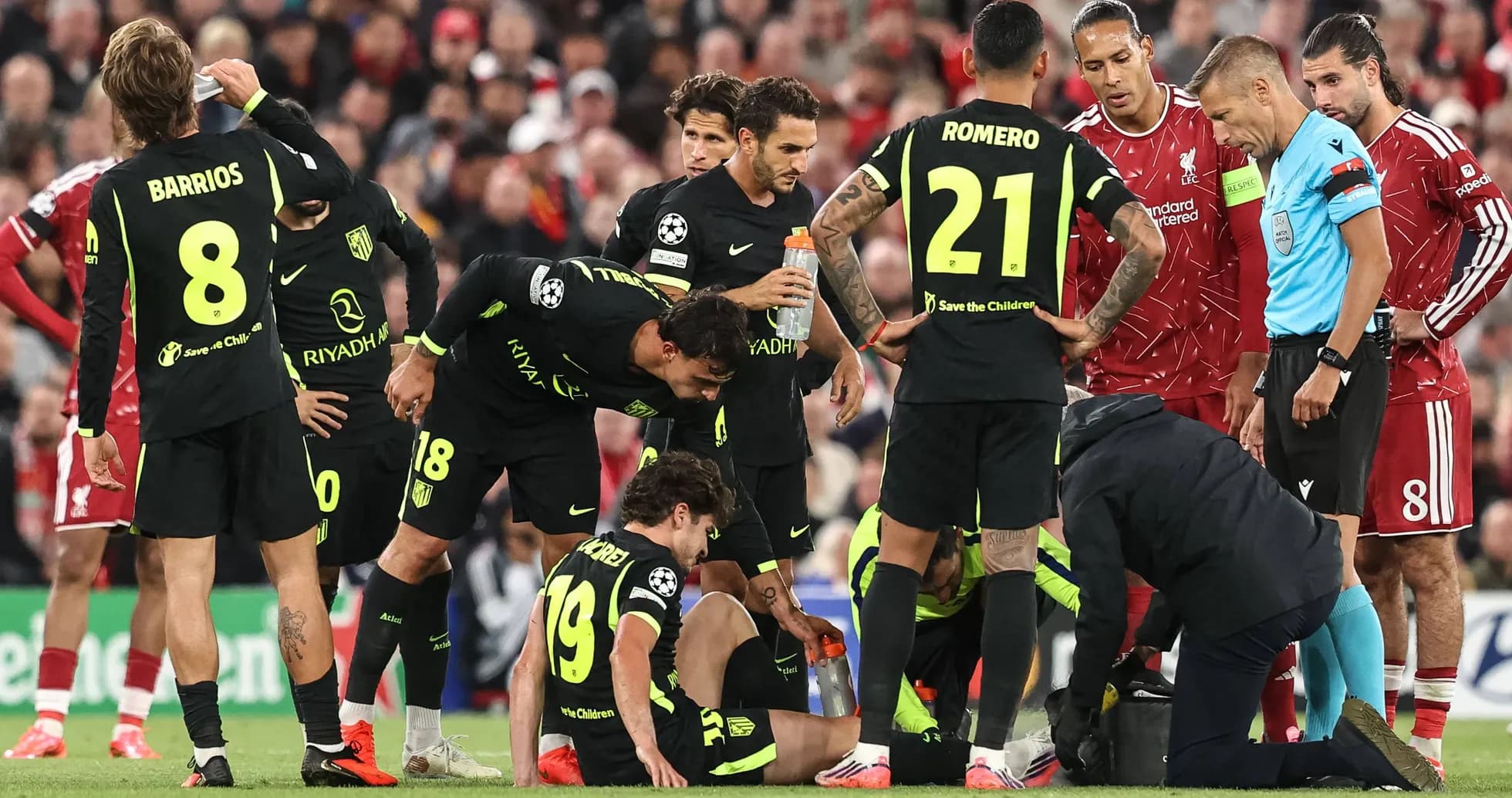 Atletico Madrid players gather around injured teammate Atletico Madrid players gather around injured teammate