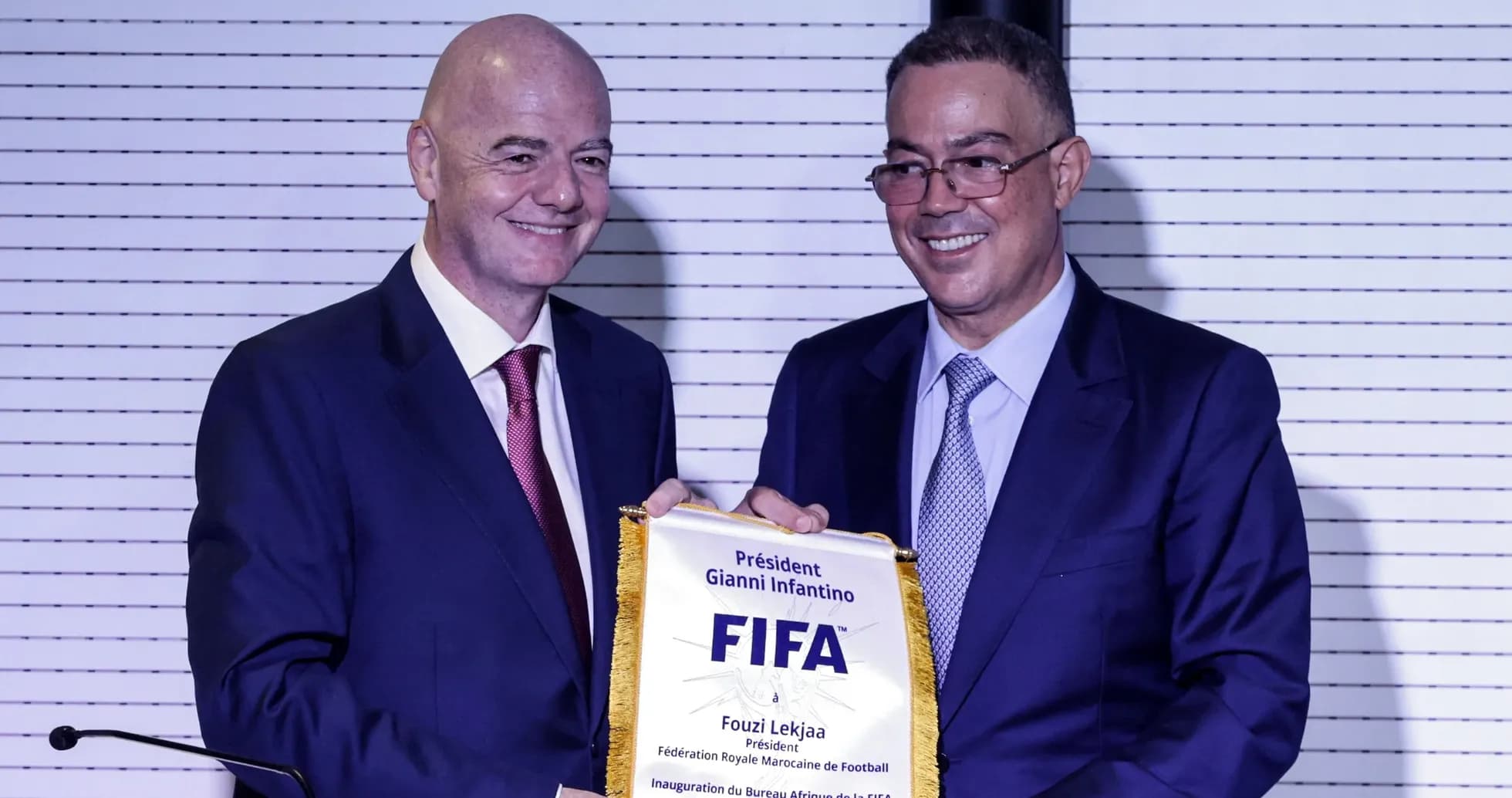 Gianni Infantino presenting FIFA plaque to Fouzi Lekjaa Gianni Infantino presenting FIFA plaque to Fouzi Lekjaa