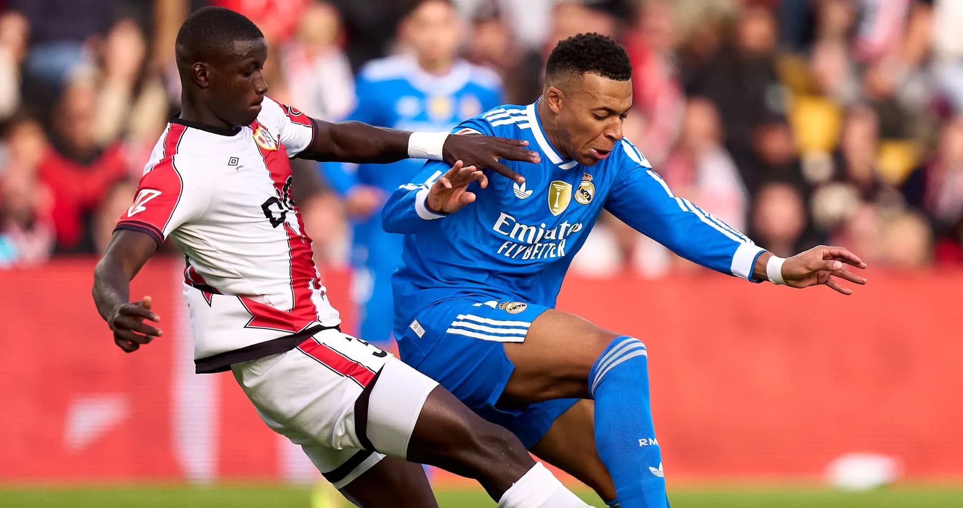 Player tackling opponent during a football match Player tackling opponent during a football match