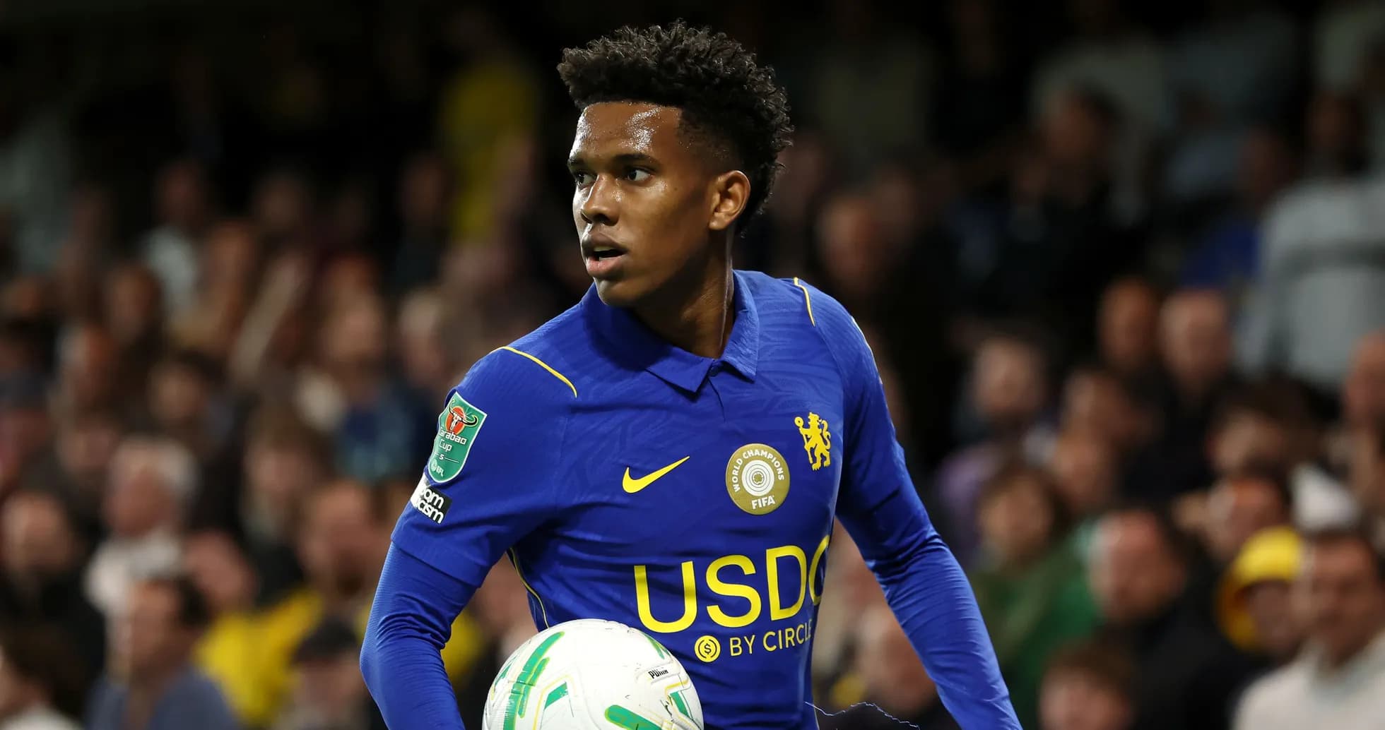 Player in blue kit holding soccer ball during match Player in blue kit holding soccer ball during match