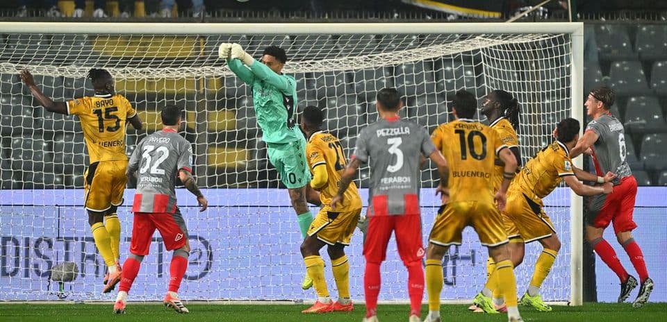 Goalkeeper makes a save during Udinese match Goalkeeper makes a save during Udinese match