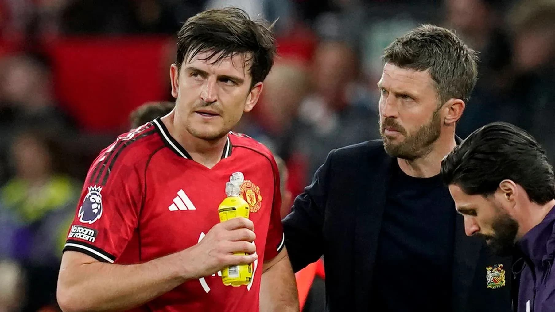 Player receiving assistance from staff during match Player receiving assistance from staff during match