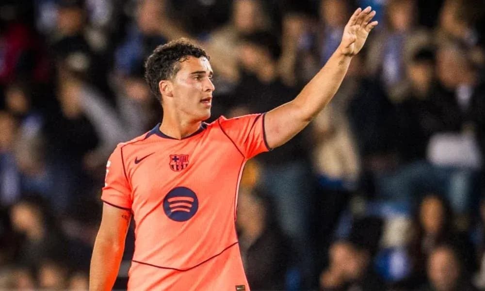 Player in orange jersey gesturing on the field Player in orange jersey gesturing on the field