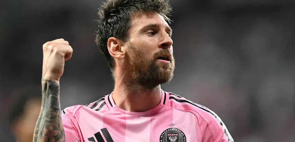 Player celebrating in pink jersey during match Player celebrating in pink jersey during match