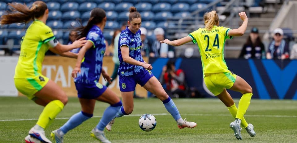 Seattle Reign FC player dribbling against Gotham FC Seattle Reign FC player dribbling against Gotham FC