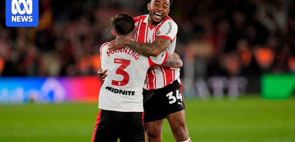 Two players celebrating together on the field Two players celebrating together on the field