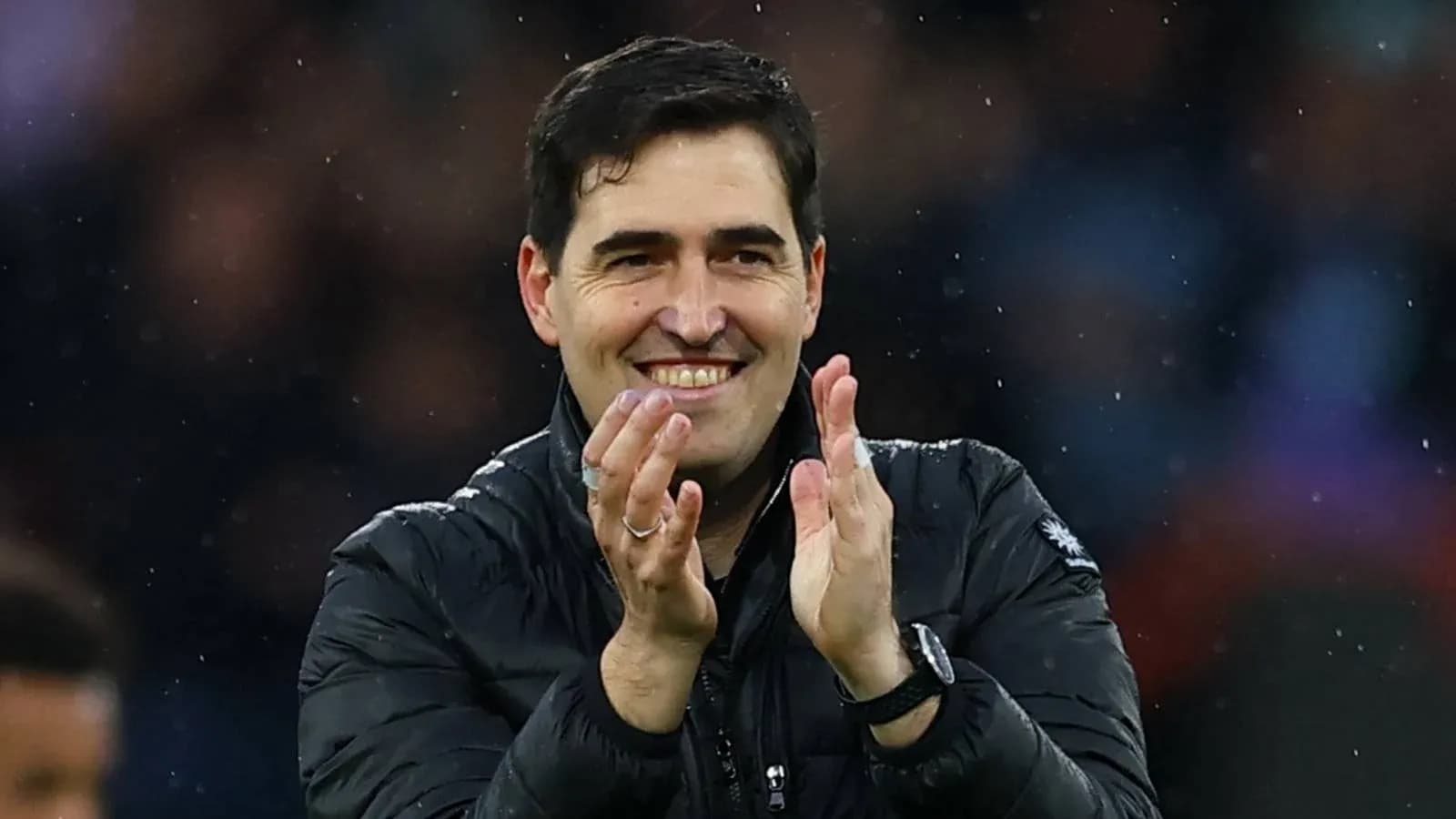Coach applauding during a match celebration Coach applauding during a match celebration