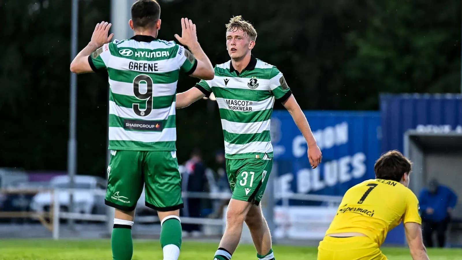Players celebrating a goal during a match Players celebrating a goal during a match