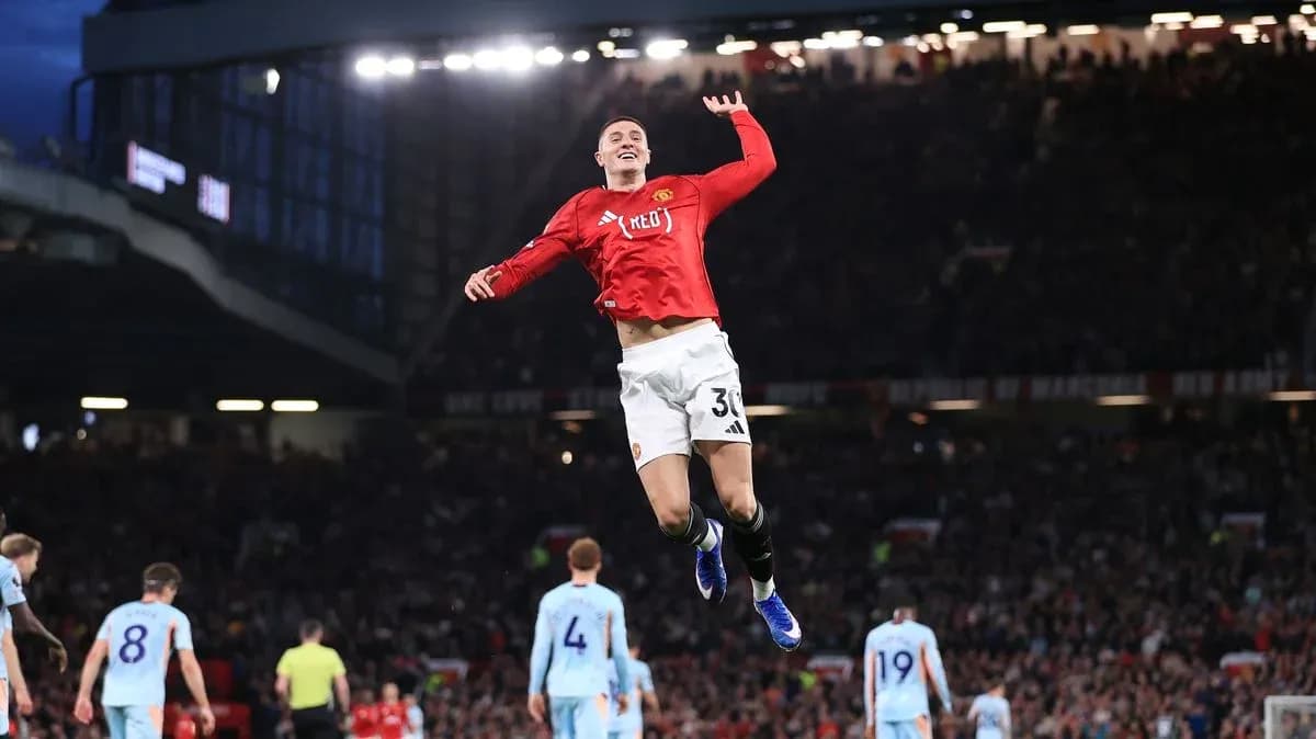 Player celebrating a goal at Old Trafford stadium Player celebrating a goal at Old Trafford stadium
