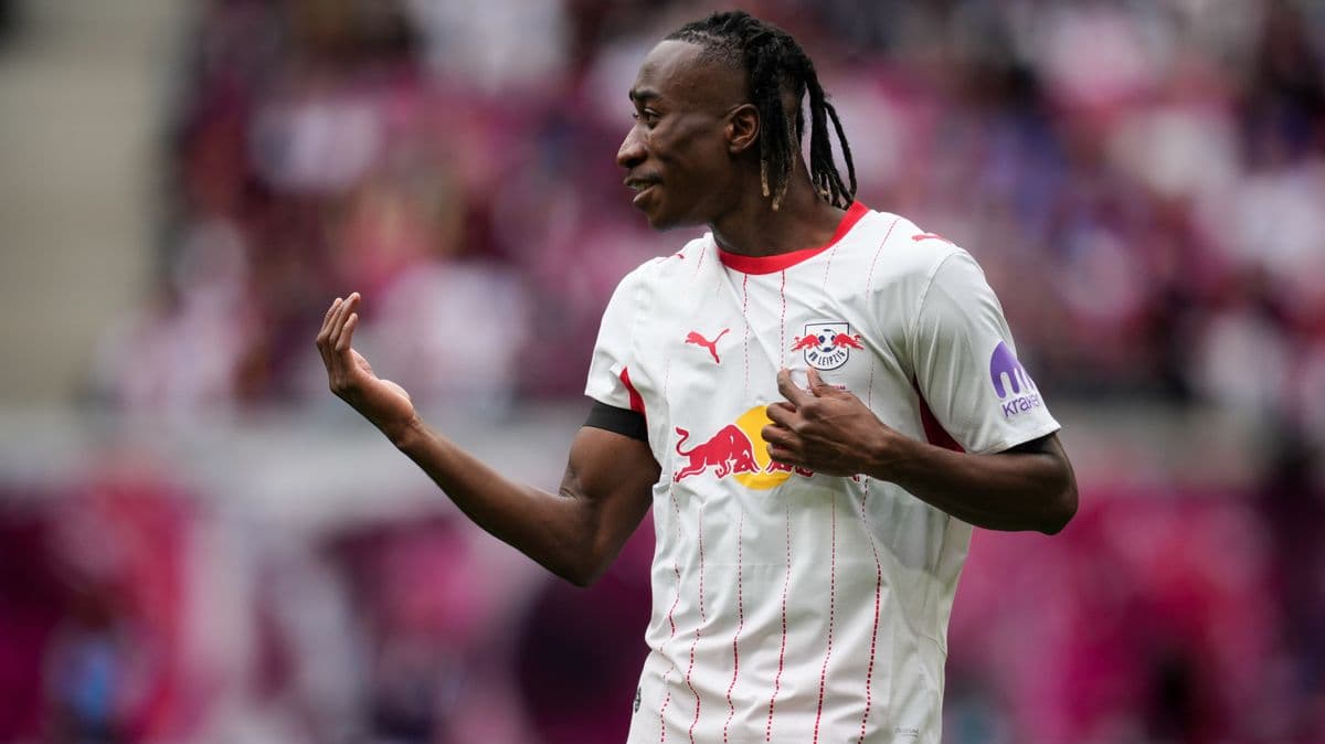 Player gesturing during match wearing RB Leipzig jersey Player gesturing during match wearing RB Leipzig jersey
