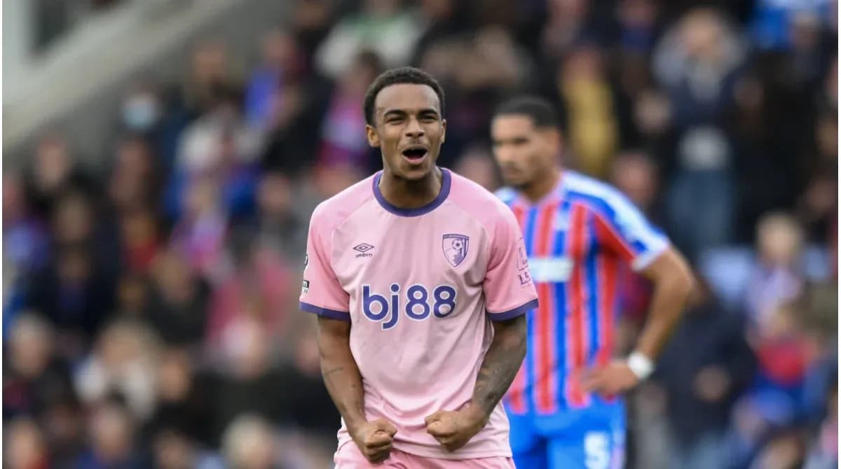 Player celebrating in pink kit during match Player celebrating in pink kit during match