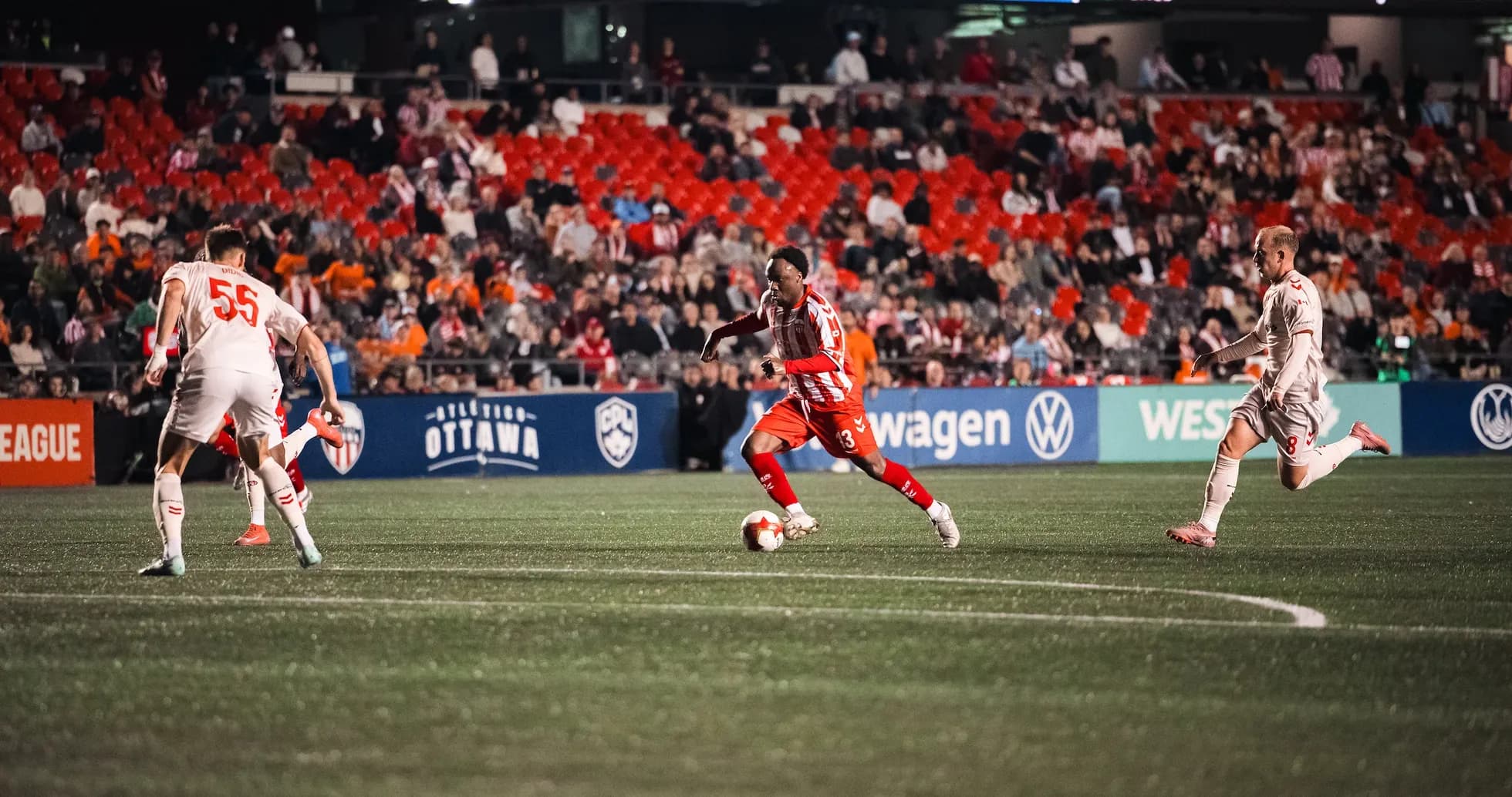 Player dribbling the ball during Atlético Ottawa match Player dribbling the ball during Atlético Ottawa match