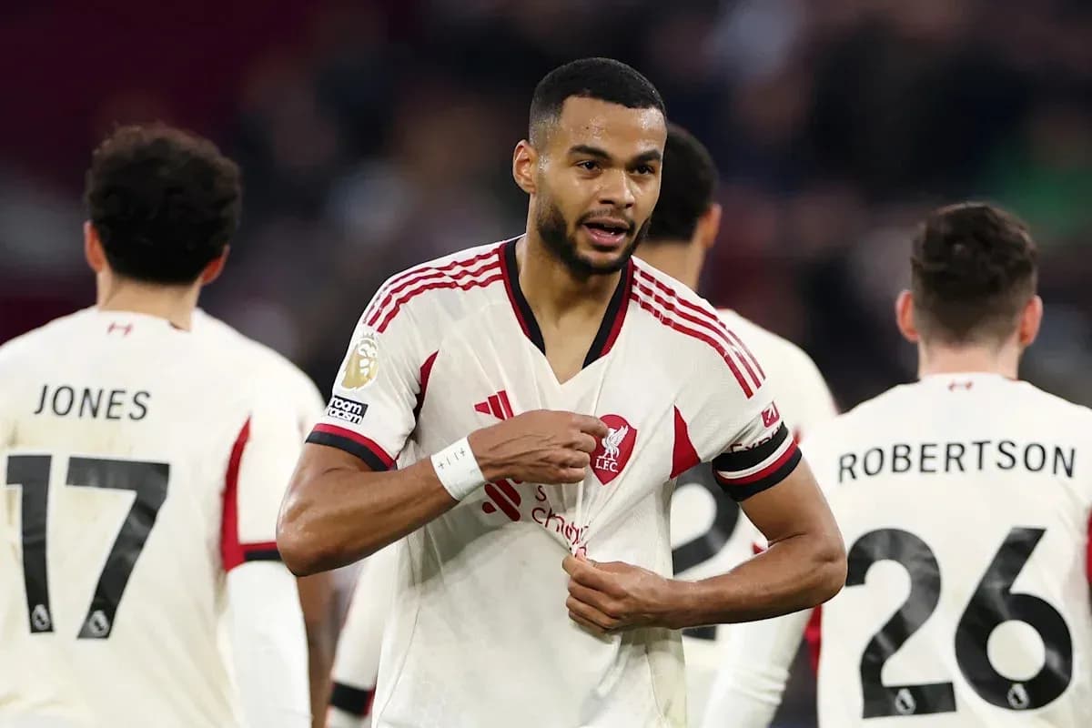 Liverpool player adjusting jersey during match Liverpool player adjusting jersey during match