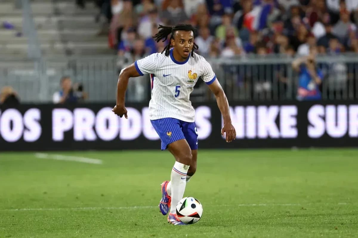 Player dribbling the ball during a soccer match Player dribbling the ball during a soccer match