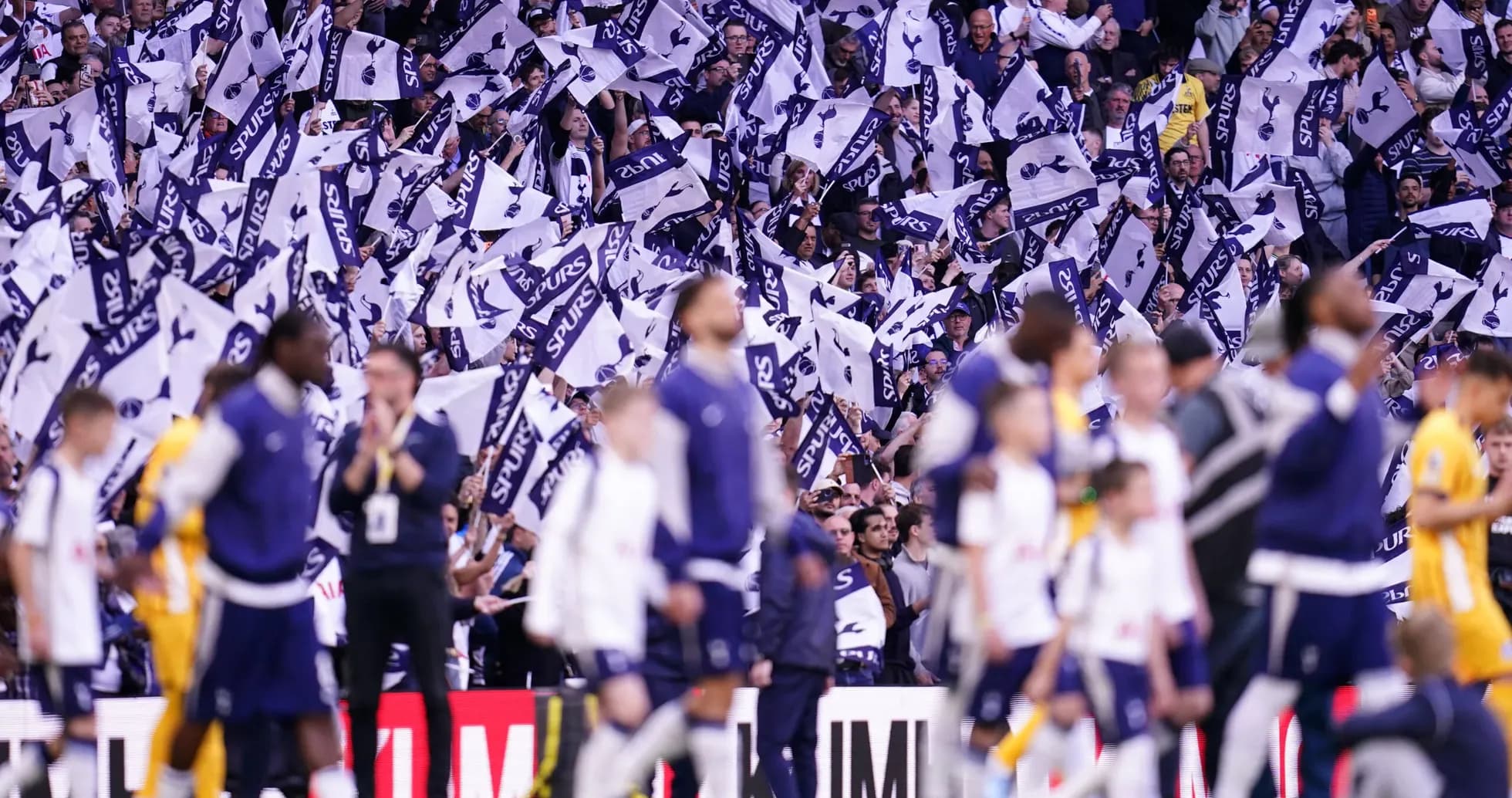 Fans waving flags during Tottenham match celebration Fans waving flags during Tottenham match celebration