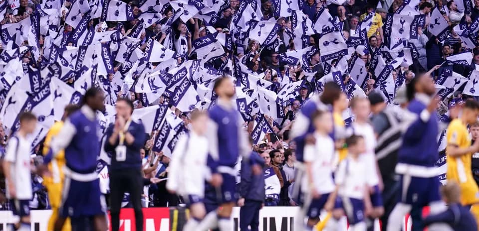 Fans waving flags during Tottenham match celebration Fans waving flags during Tottenham match celebration