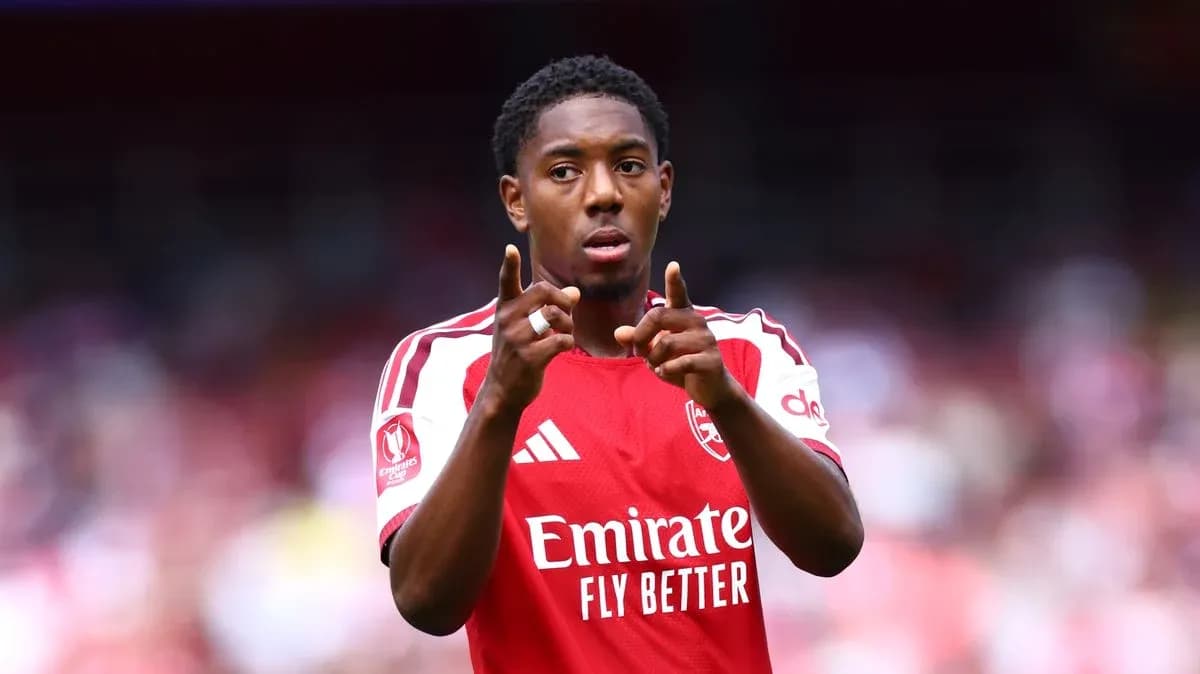 Player gesturing during match in Arsenal jersey Player gesturing during match in Arsenal jersey