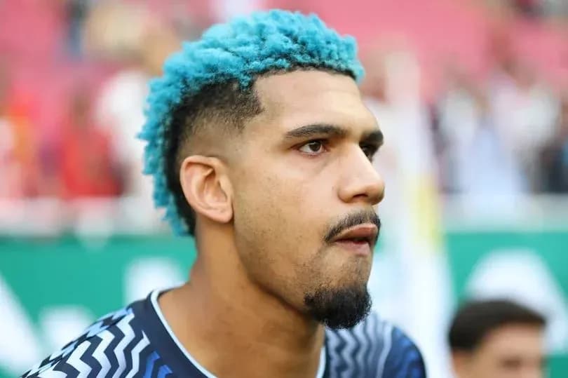 Goalkeeper with blue hair before match Goalkeeper with blue hair before match
