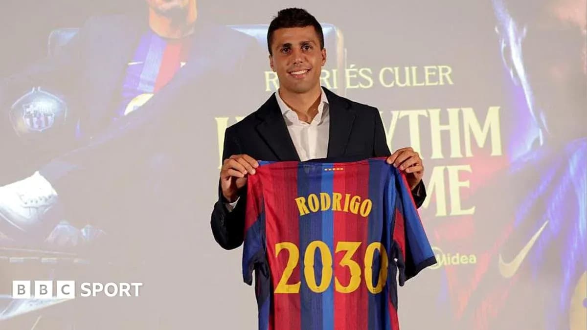 Player holding FC Barcelona jersey at presentation event Player holding FC Barcelona jersey at presentation event