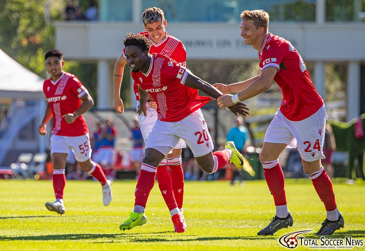 Players celebrating a goal during match Players celebrating a goal during match
