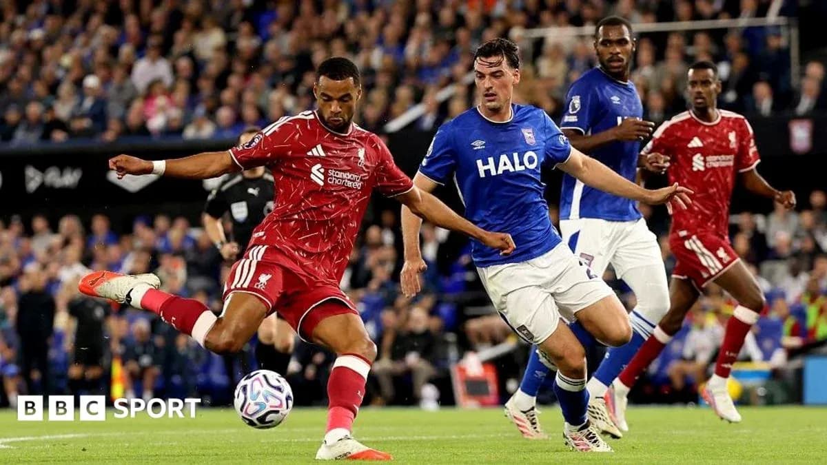 Liverpool player kicking the ball during match Liverpool player kicking the ball during match