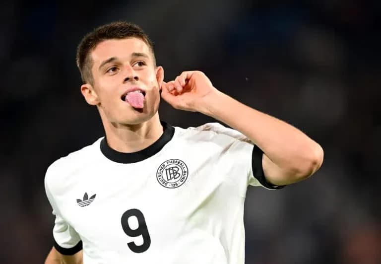 Player celebrating with tongue out after scoring Player celebrating with tongue out after scoring