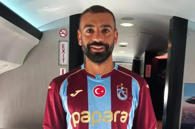 Player wearing Trabzonspor jersey inside airplane Player wearing Trabzonspor jersey inside airplane